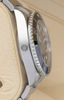 Left side profile view of the 2019 Rolex Sea-Dweller 126600 highlighting the integrated helium escape valve on the polished steel case.