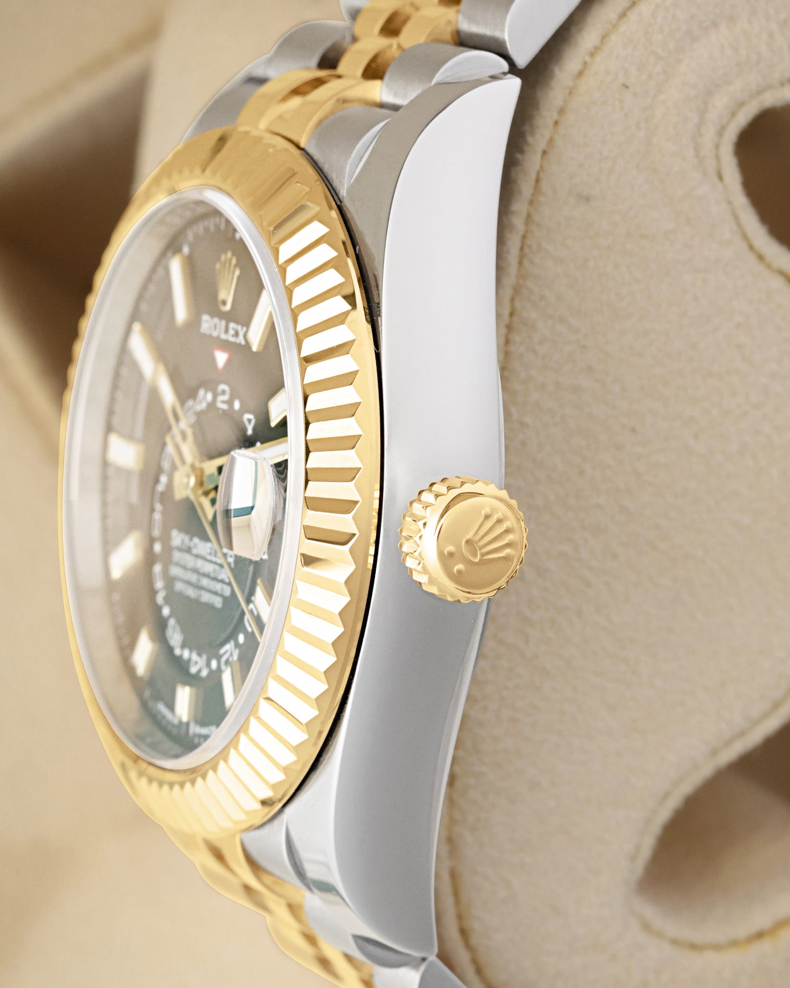 Side profile focusing on the polished Oystersteel case tier, Twinlock winding crown, and Chronergy-driven Calibre 9002 updates of the Rolex Sky-Dweller