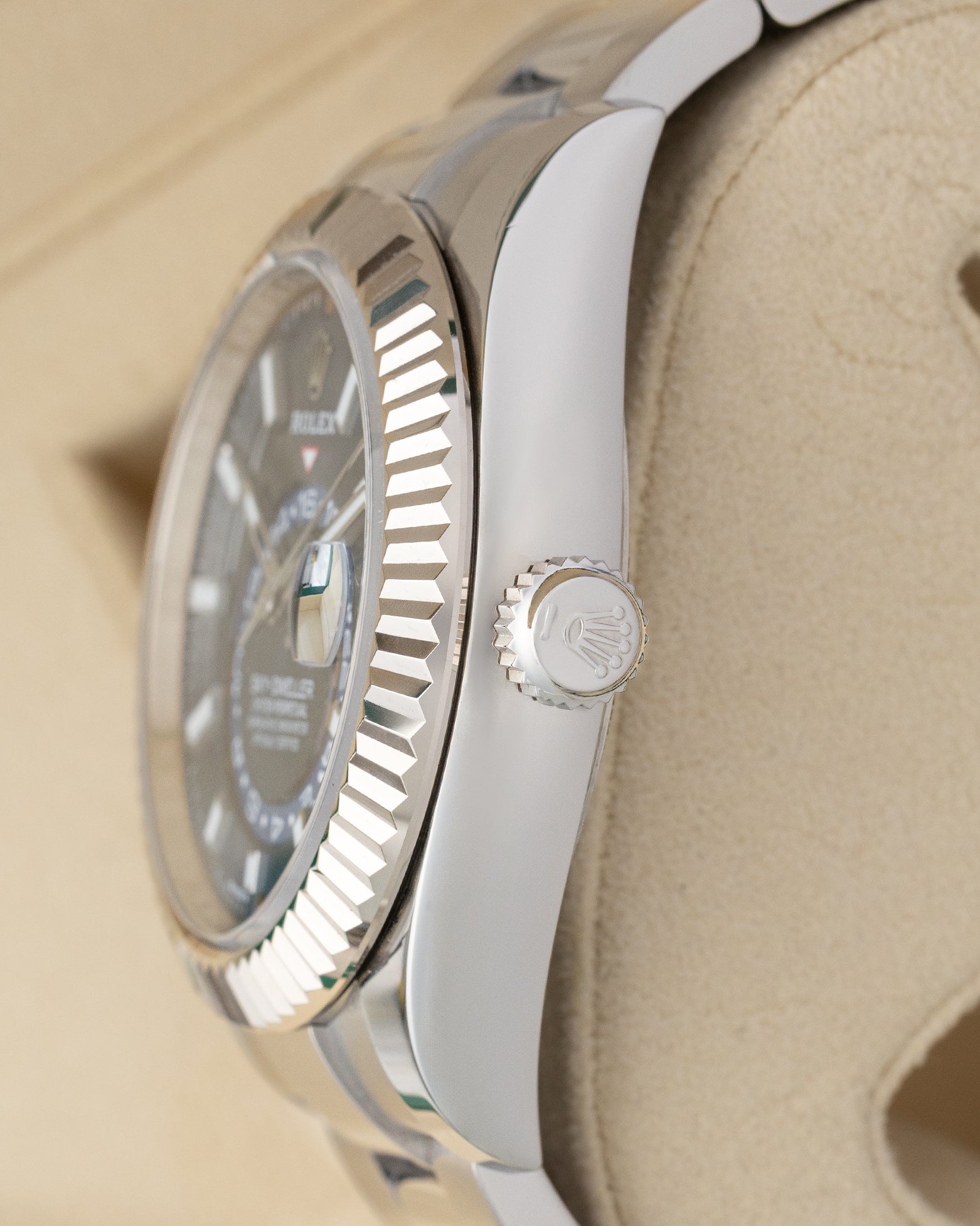 Close-up right profile view of the 42mm Rolex Sky-Dweller 336934 case highlighting the white gold Ring Command bezel and crown
