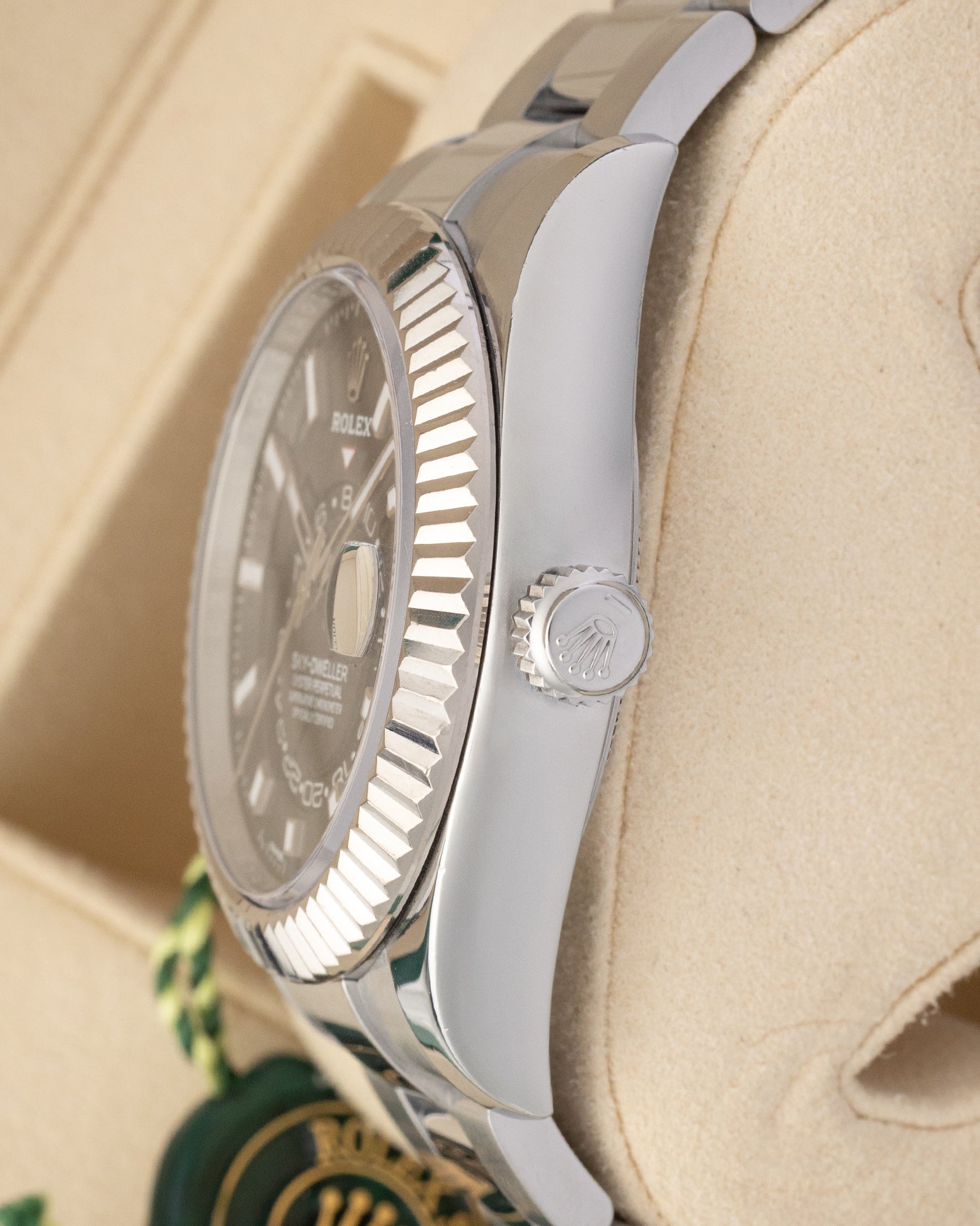 Close-up right profile view of the watch head highlighting the complex 18k white gold fluted Ring Command bezel, flat sapphire crystal, and screw-down Twinlock winding crown