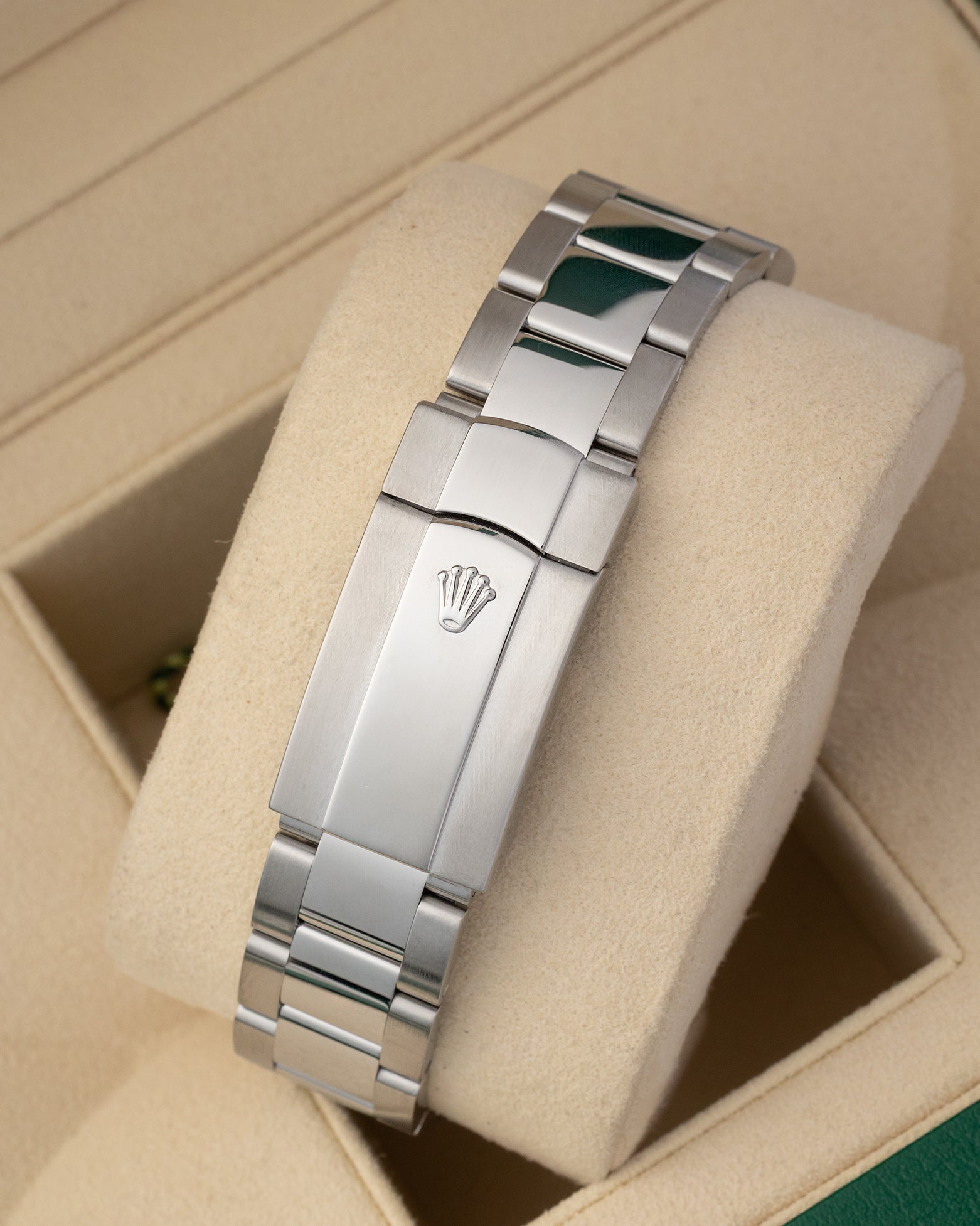 A rear view of the three-row steel link band focusing on the secure closure of the folding Oysterclasp deployant buckle detailed with an integrated Easylink comfort extension system