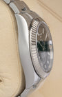 Left-side macro profile view showcasing the mirror-polished finish across the Oystersteel caseband flank and the substantial integrated sweep of the solid professional lugs