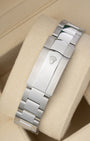 rear view snapshot focusing on the brushed stainless steel three-link Oyster bracelet and its folding Oysterclasp closure with embossed crown