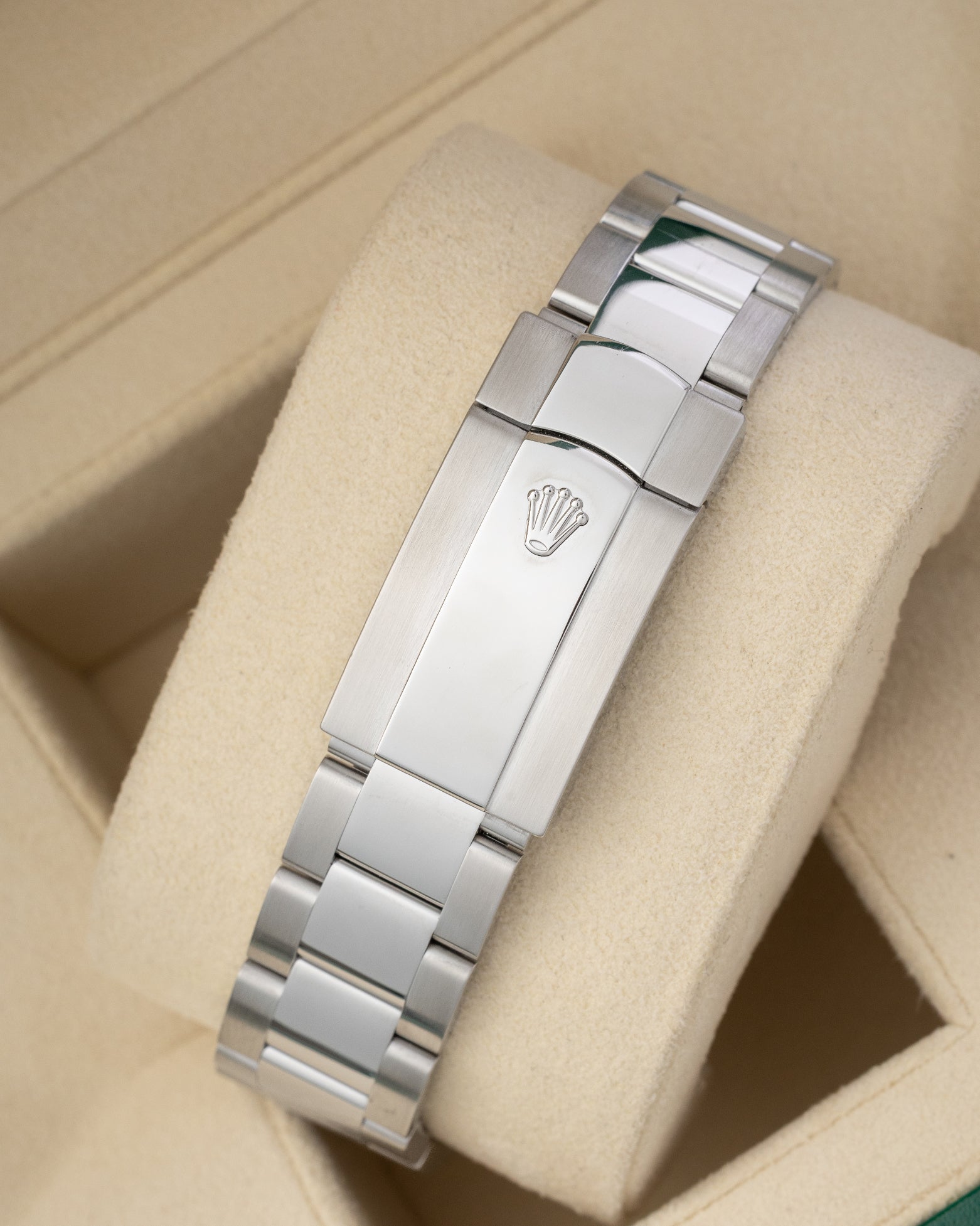 rear view snapshot focusing on the brushed stainless steel three-link Oyster bracelet and its folding Oysterclasp closure with embossed crown