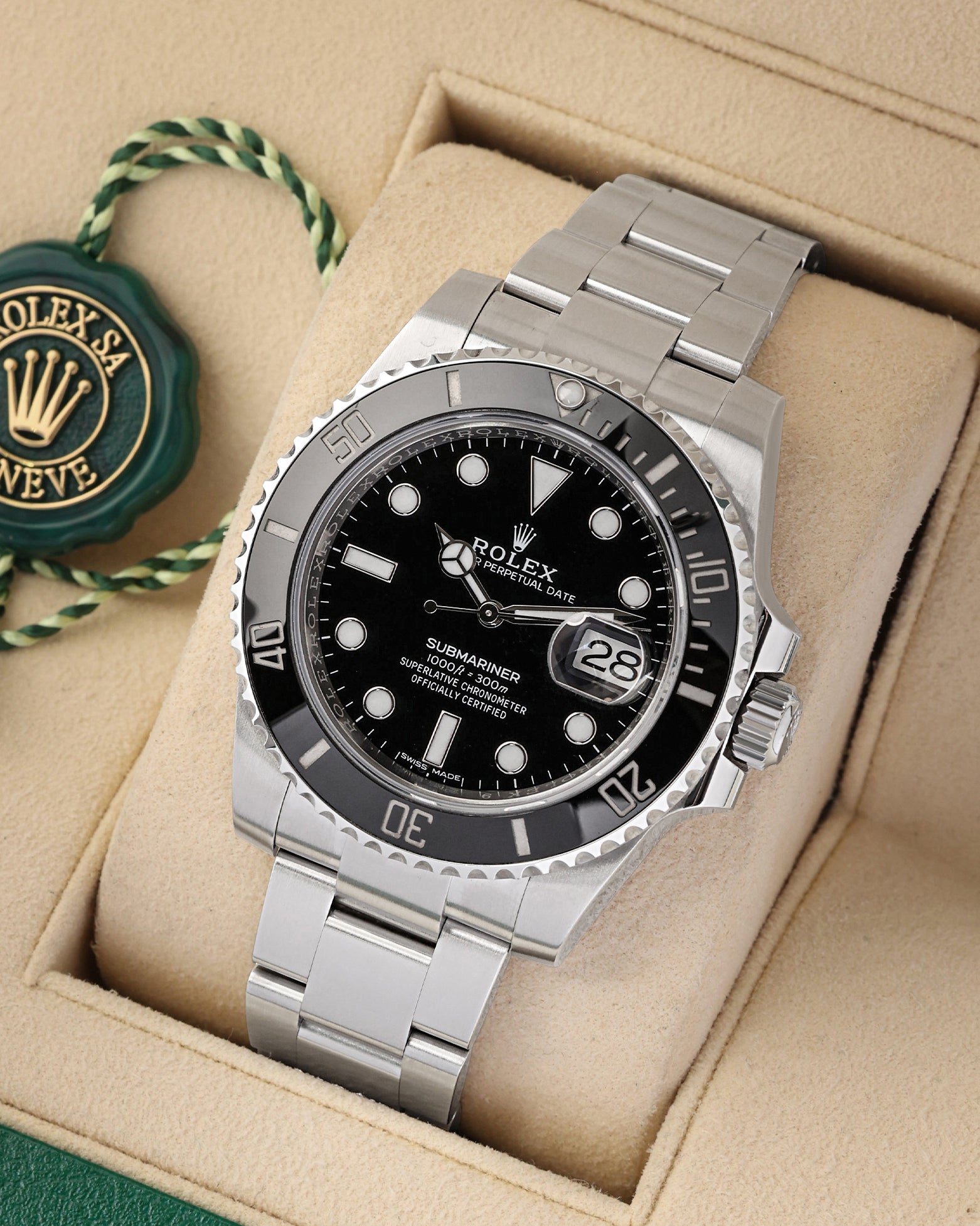 A high-angle three-quarter studio portrait of the 40mm Oystersteel Submariner case showcasing its blocky Super Case lug profiles and solid flat-brushed Oyster bracelet links