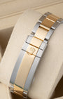 Back view showing the two-tone 18k yellow gold and stainless steel Oysterlock safety clasp with Glidelock extension system on a 2018 Rolex Submariner 116613LB