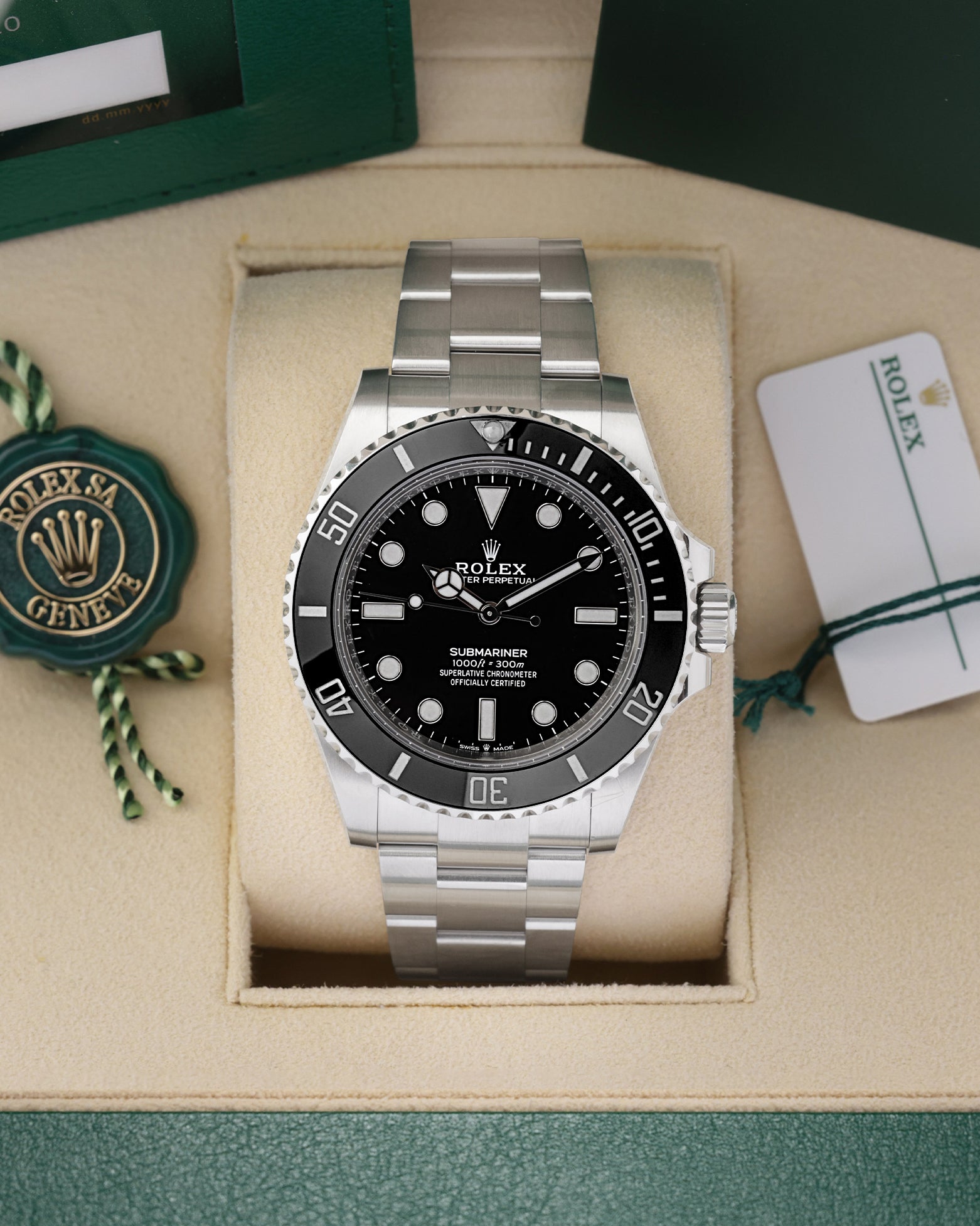 Front portrait of a pre-owned 2025 Rolex Submariner No-Date ref 124060 in its presentation box, available at Noahs Fine Watches and Jewelry Dallas