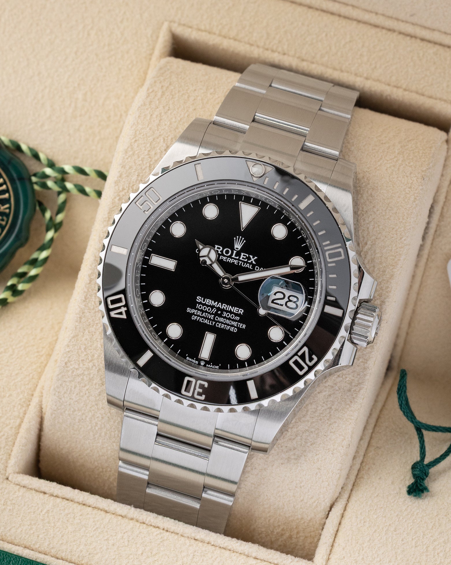 Angled front view of a pre owned 2025 Rolex Submariner Date 126610LN featuring a black dial, Cyclops date window, and ceramic bezel
