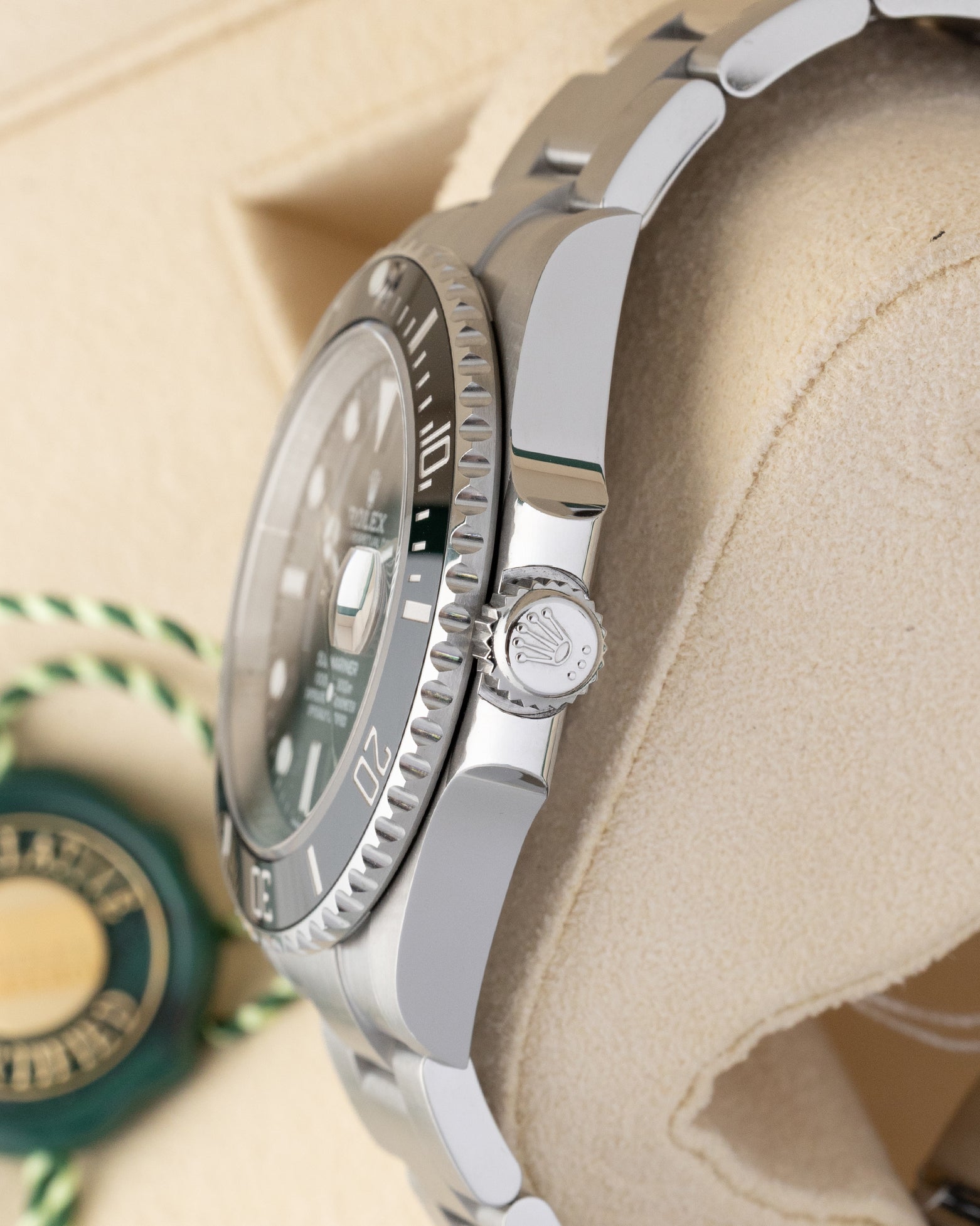 Side profile showing the 41mm Oystersteel case, crown guards, and signed Triplock winding crown on a Rolex Submariner Date 126610LN