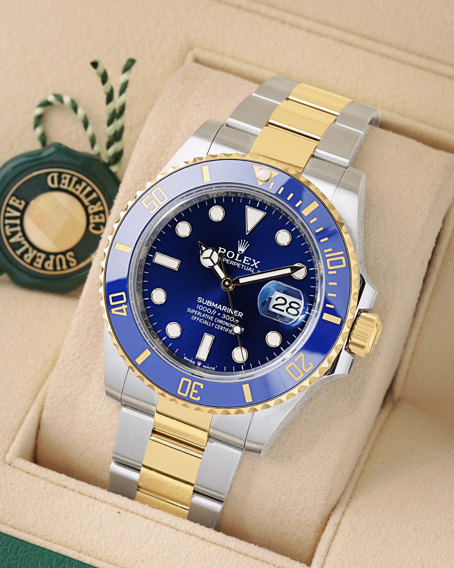 Angled view of 2026 Rolex Submariner 126613LB featuring a royal blue dial, blue ceramic bezel, and 18k yellow gold Rolesor bracelet