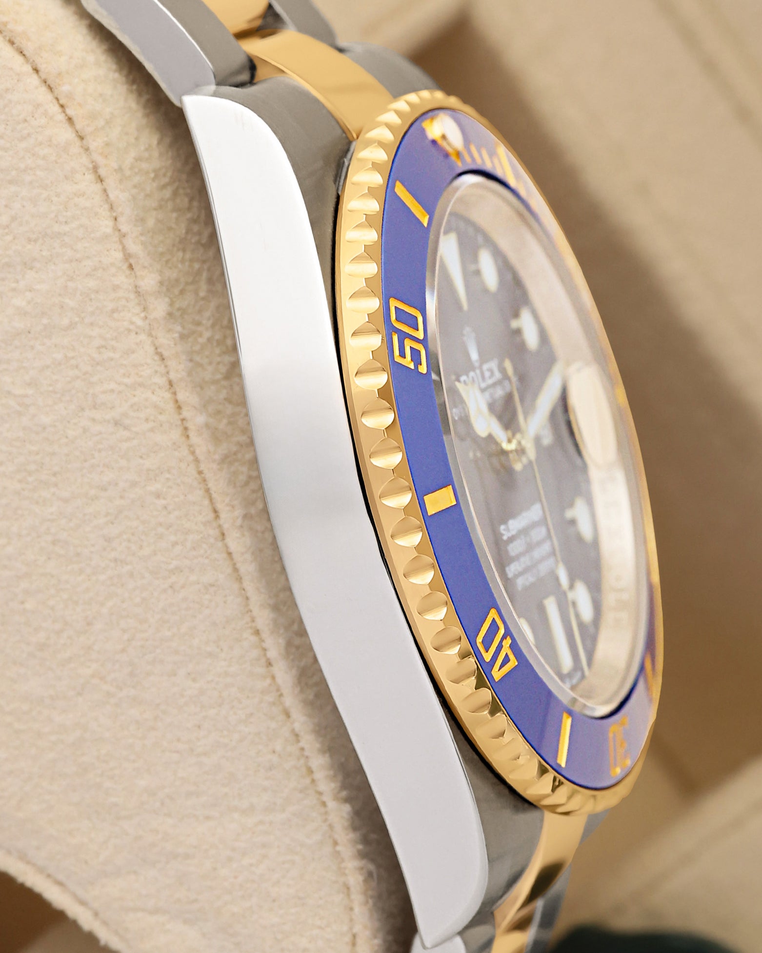 Side profile view of the 41mm Yellow Rolesor case for brand new 2026 Rolex Submariner Date 126613LB