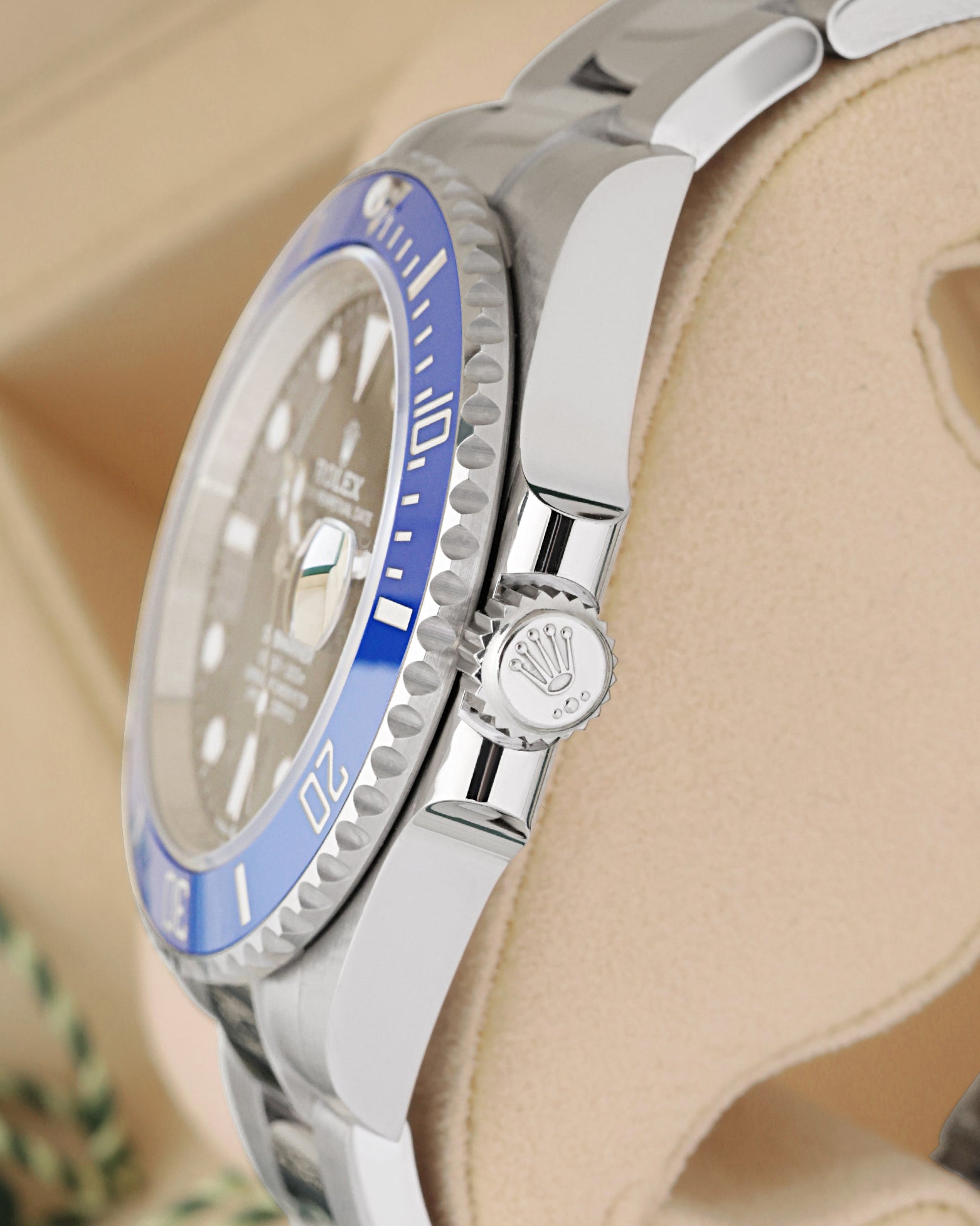 Side view close-up of the 18k white gold Triplock crown and blue ceramic bezel on Rolex Submariner Date 126619LB