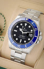 Three-quarter view of Rolex Submariner Date 126619LB featuring 18k white gold case, blue Cerachrom bezel, and black dial
