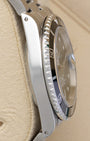 Left side profile view of the brushed and polished stainless steel case on a 1999 Rolex Submariner Date reference 16610