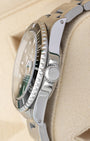 Side profile showing the 40mm stainless steel case, crown guards, and signed Triplock winding crown on a Rolex Submariner Date 16610