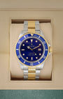 Vintage 1986 Rolex Submariner Date Bluesy 16803 two-tone blue dial watch at Noah's Fine Watches & Jewelry in Dallas, TX.