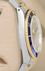 Side profile view showing the holes case design of the vintage 1986 Rolex Submariner 16803 in stainless steel and 18k gold