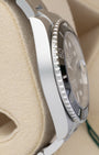 Left side profile view highlighting the polished steel case wall on a preowned 2025 Rolex Submariner Date reference 126610LN