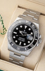 Angled front view of a pre-owned 2026 Rolex Submariner Date 126610LN featuring a black dial, date window with Cyclops lens, and ceramic bezel