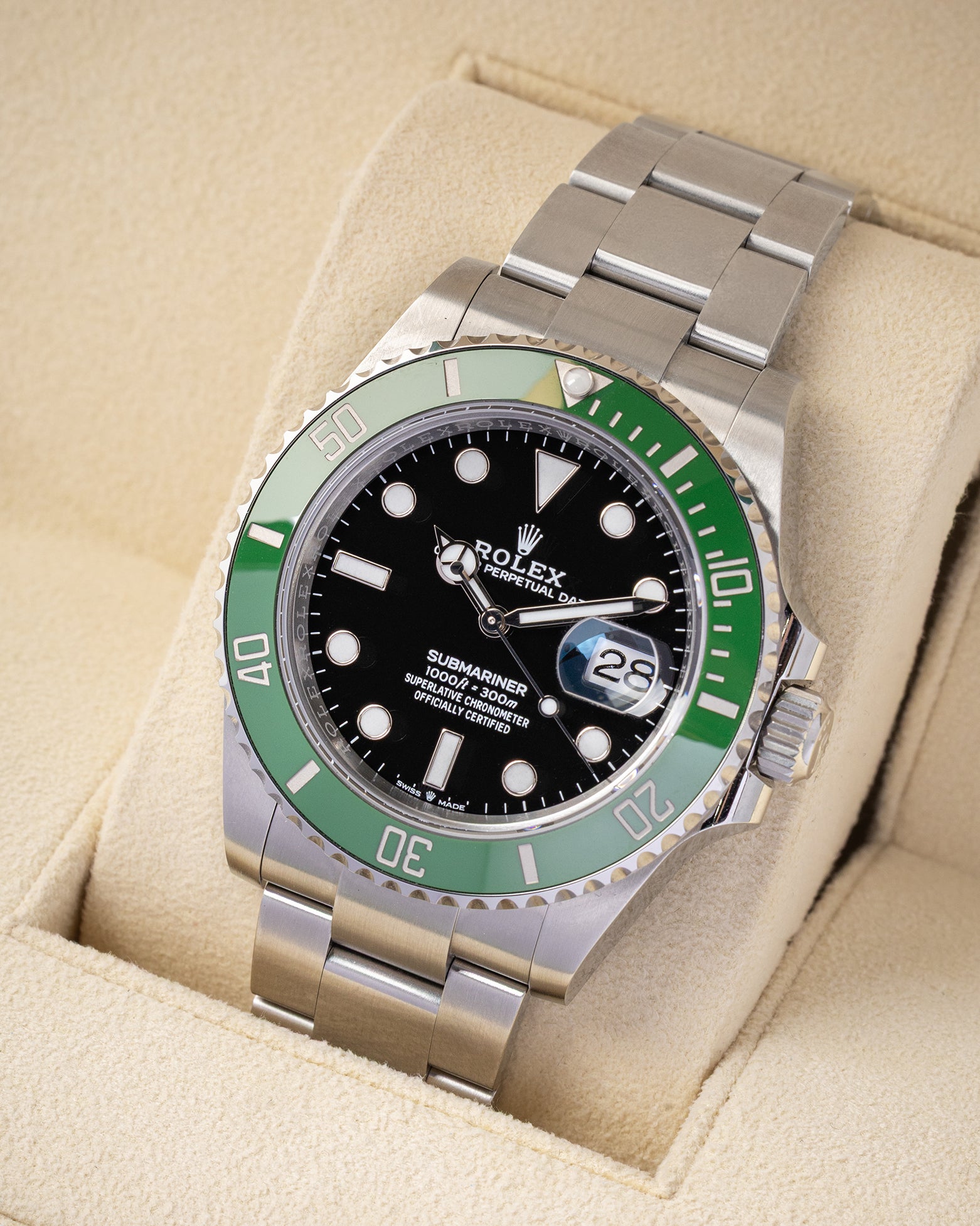 Angled view of unworn 2026 Rolex Submariner Date 41mm ref 126610LV featuring a green ceramic bezel and black dial