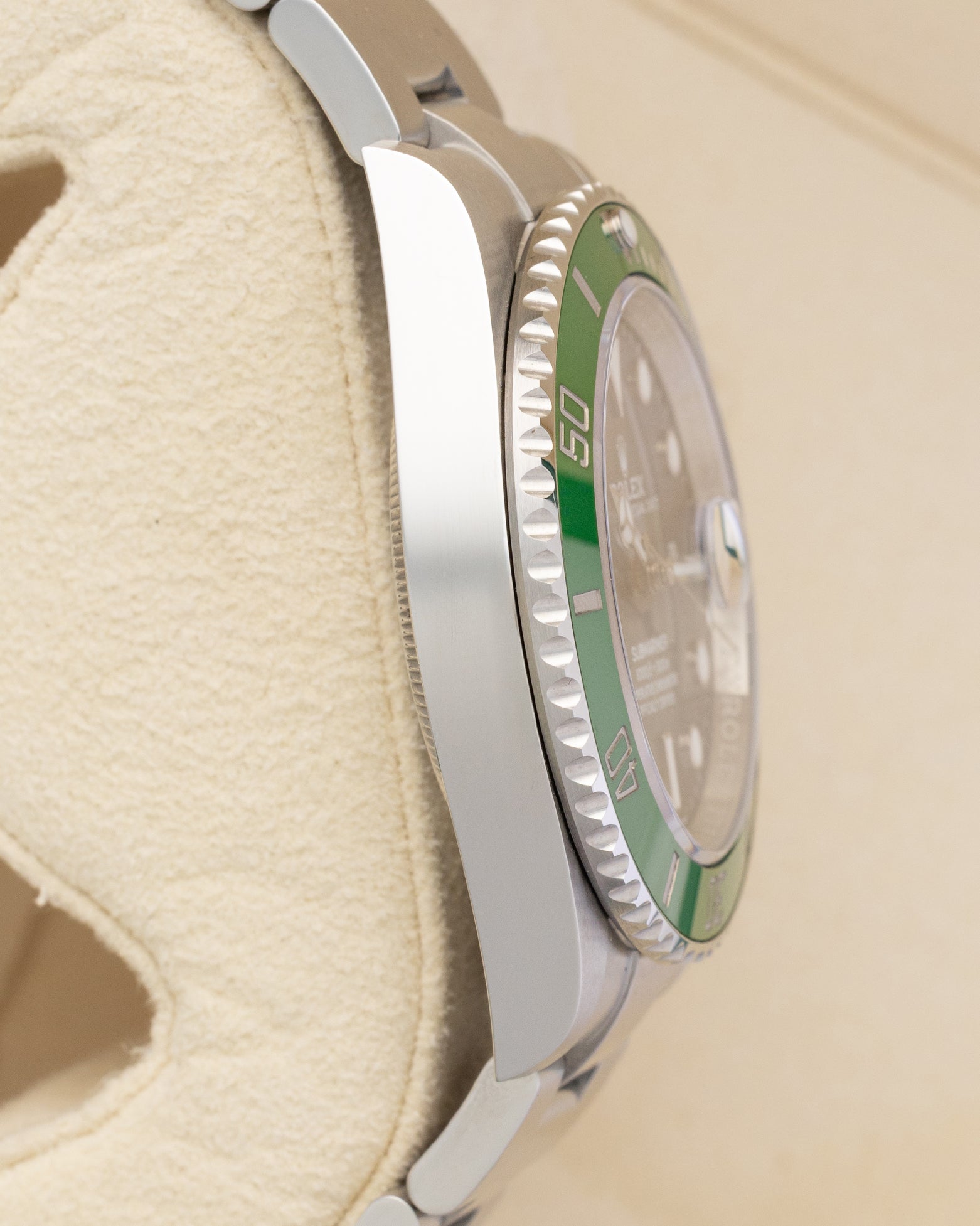 Polished Oystersteel case side view of brand new 2026 Rolex Submariner Date 126610LV Starbucks