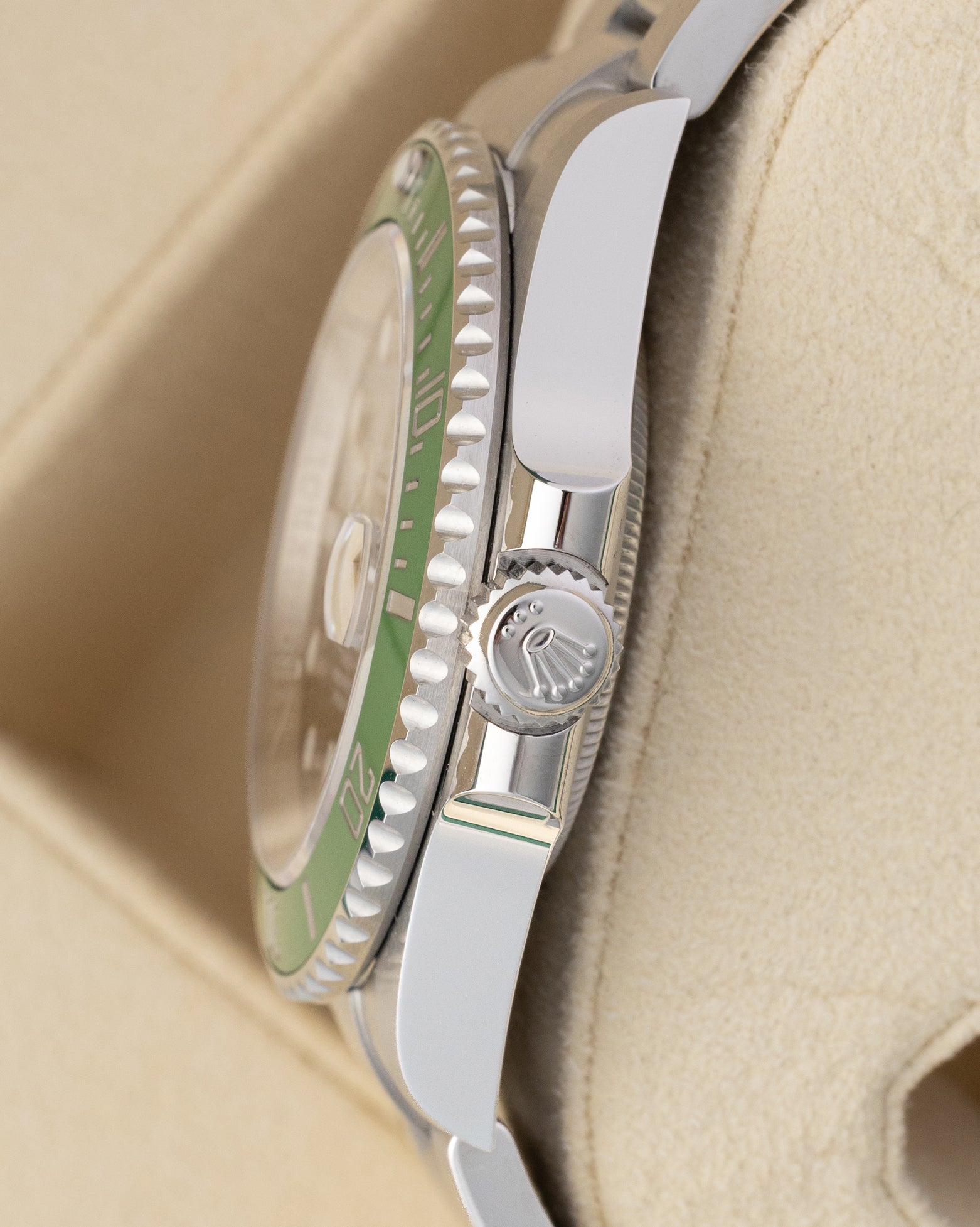 Side profile view showing the Triplock crown and stainless steel case of an unworn 2026 Rolex Submariner Date 126610LV
