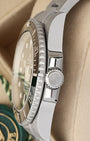 Close-up right profile view of the watch head highlighting the knurled edge of the ceramic dive bezel and the heavy-duty fluted Triplock triple-waterproofness winding crown