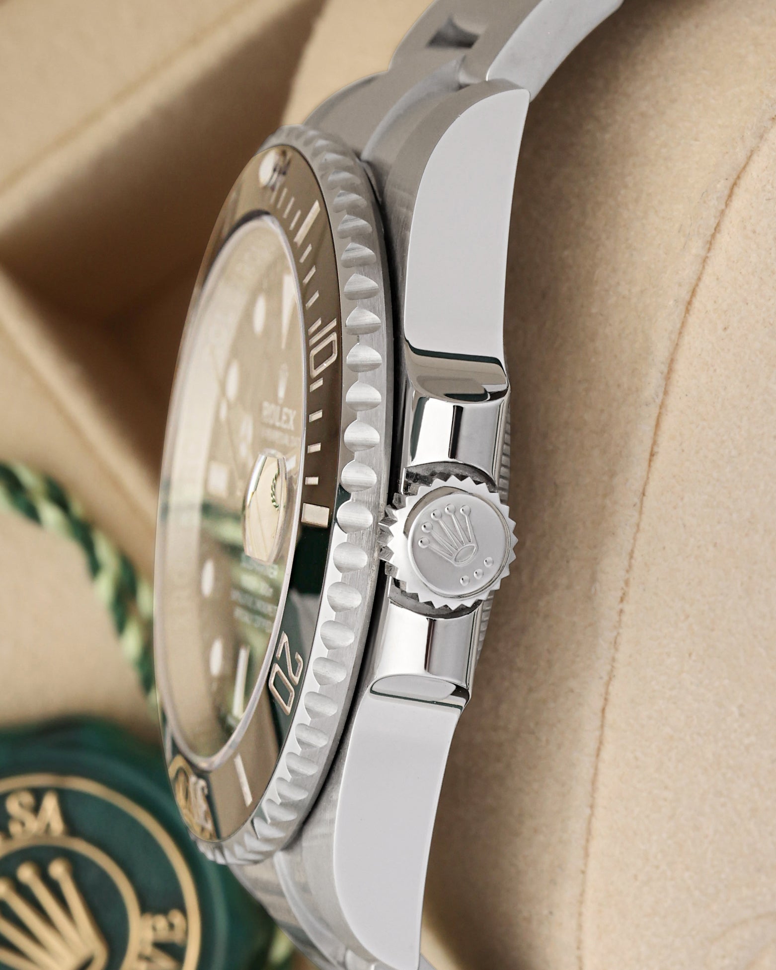 Close-up right profile view of the watch head highlighting the knurled edge of the ceramic dive bezel and the heavy-duty fluted Triplock triple-waterproofness winding crown