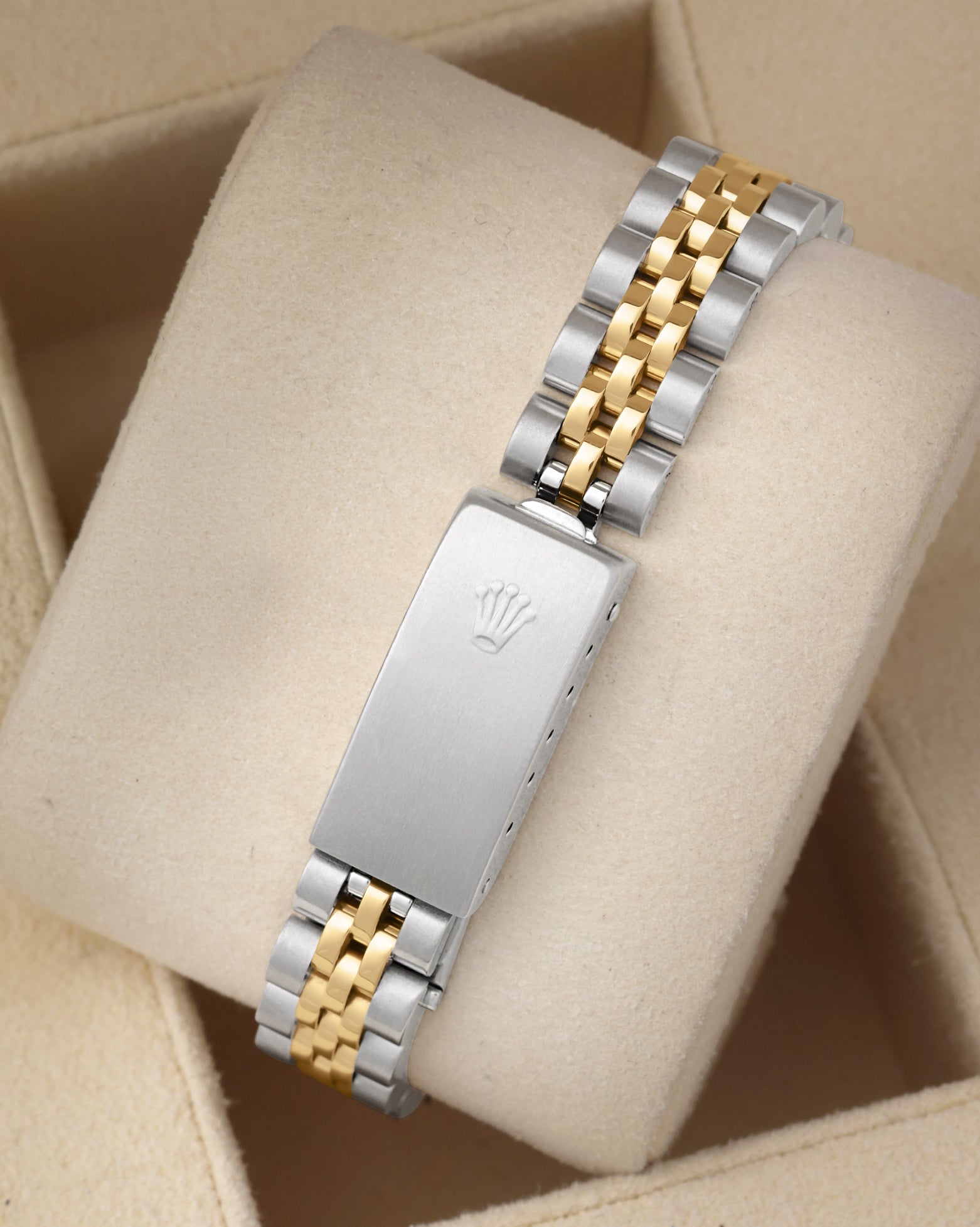 Rear view of the stainless steel and 18k yellow gold Rolex Jubilee bracelet highlighting the folding clasp with the embossed Rolex crown