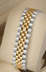 Rear perspective of the classic five-piece link yellow Rolesor two-tone Jubilee bracelet featuring the sleek hidden Crownclasp design