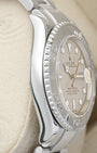 left-side case profile view of a pre-owned 2006 40mm stainless steel Rolex Yacht-Master Oyster case resting on a cushion
