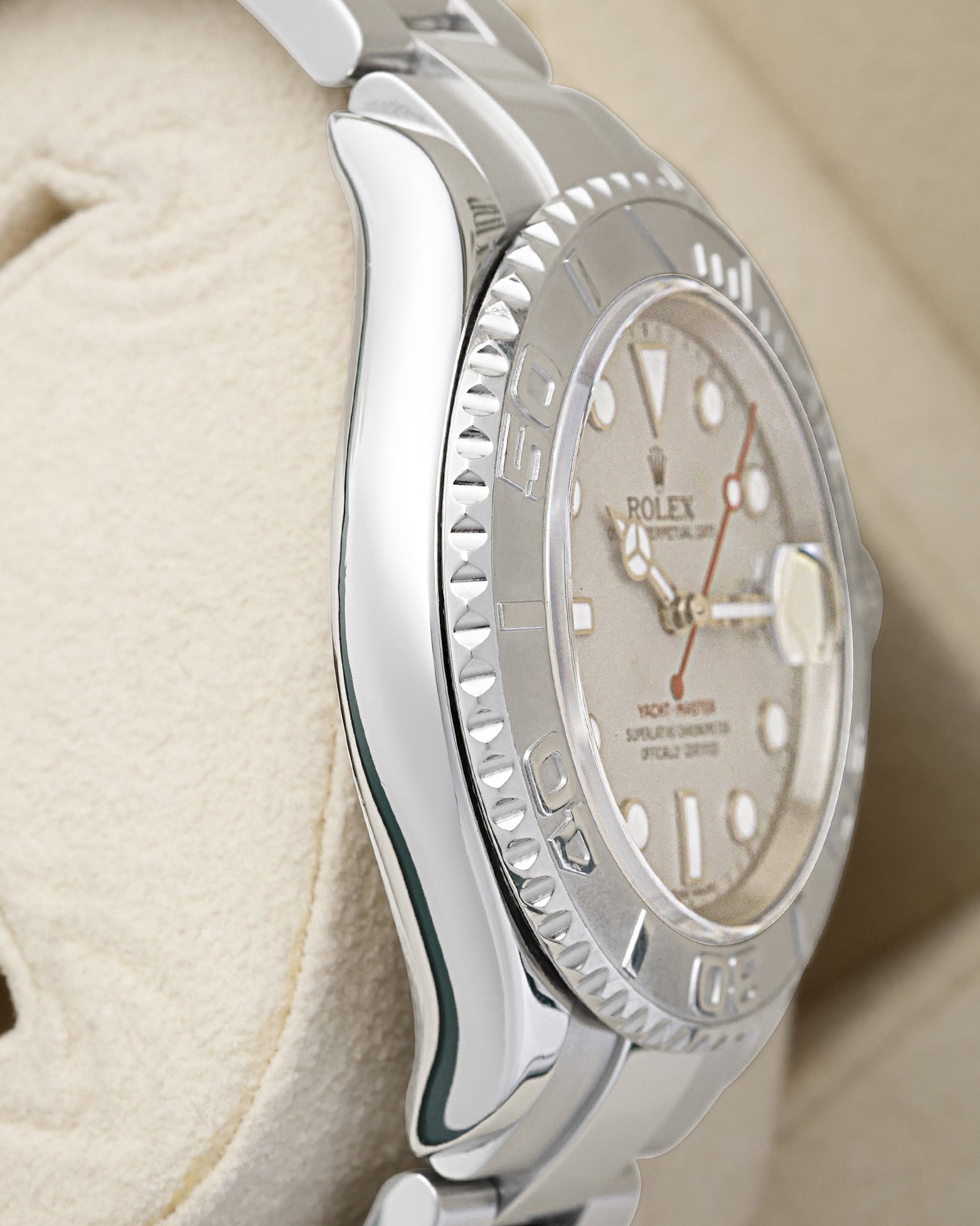left-side case profile view of a pre-owned 2006 40mm stainless steel Rolex Yacht-Master Oyster case resting on a cushion