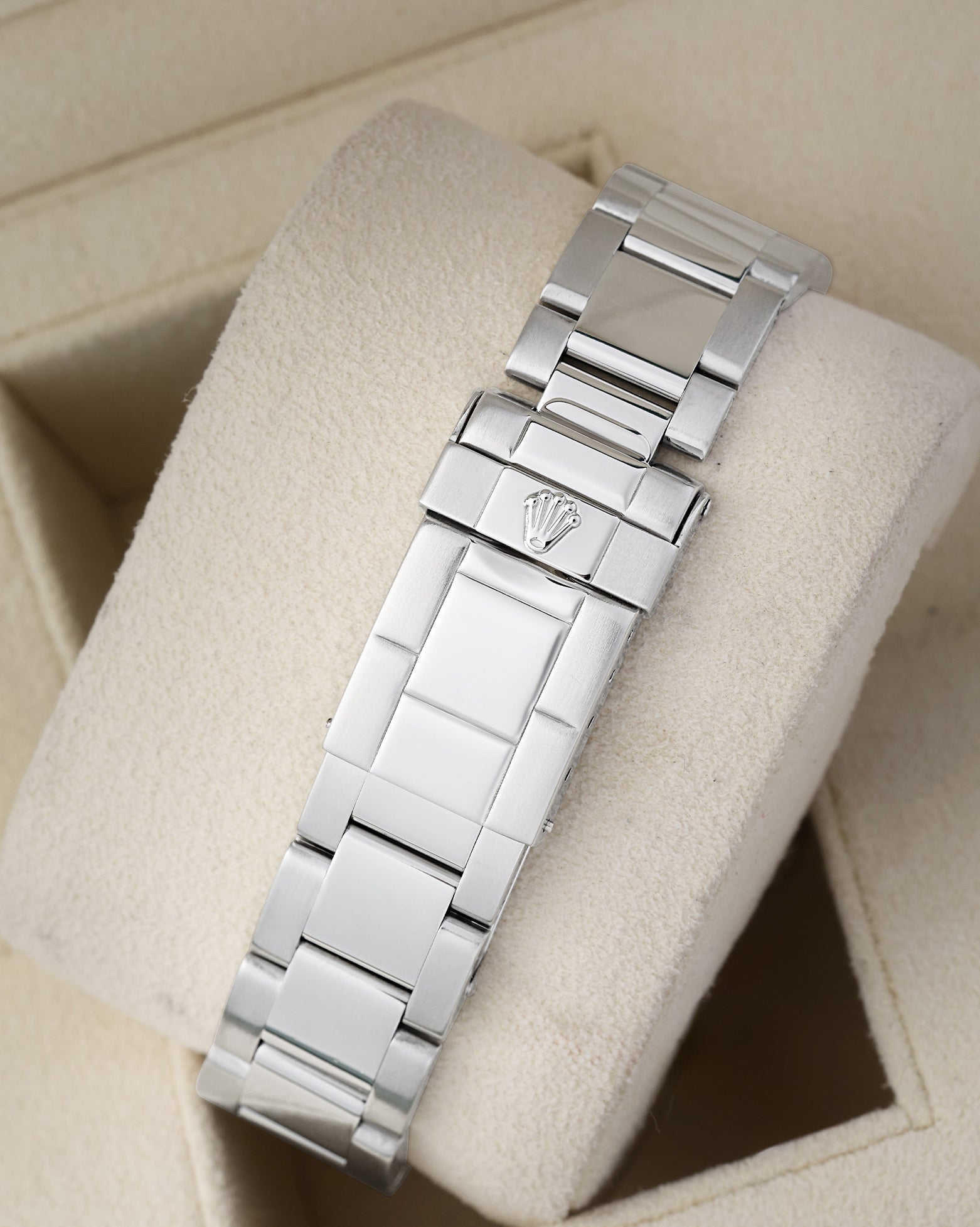 Rear view of the stainless steel Oyster bracelet showing the traditional folding safety deployment clasp with the embossed Rolex crown coronet logo