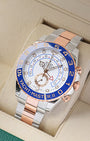 Angled front view of an Everose gold and stainless steel Rolex Yacht-Master II 44mm regatta chronograph inside its green presentation box in Dallas