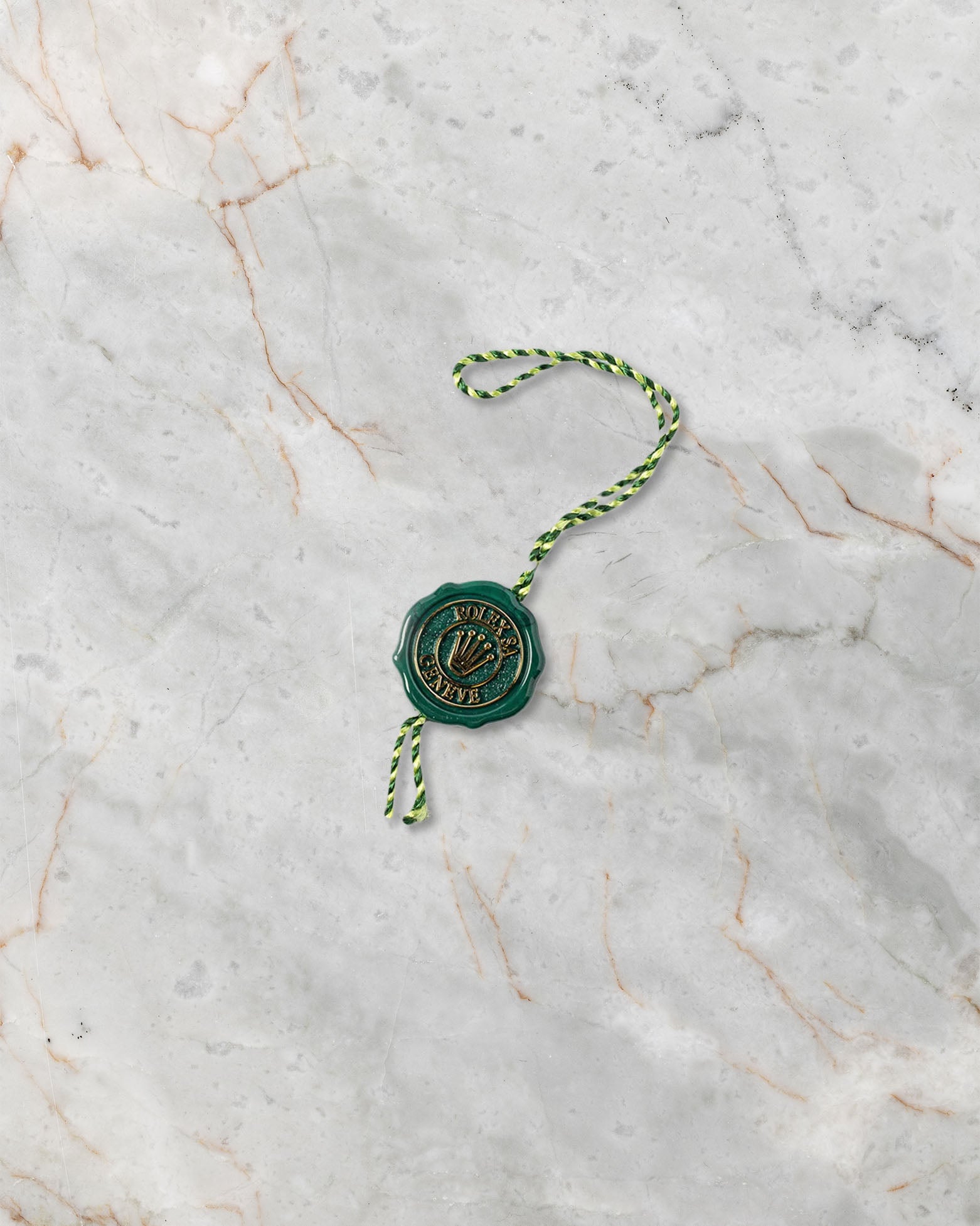 Original Rolex green Superlative Chronometer seal hangtag included with the 2026 unworn Yacht-Master II 126680.