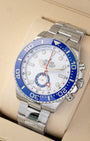 Angled shot of an unworn 2026 Rolex Yacht-Master II 44mm reference 126680 showing the blue Ring Command bezel and factory plastic stickers on the Oyster bracelet.