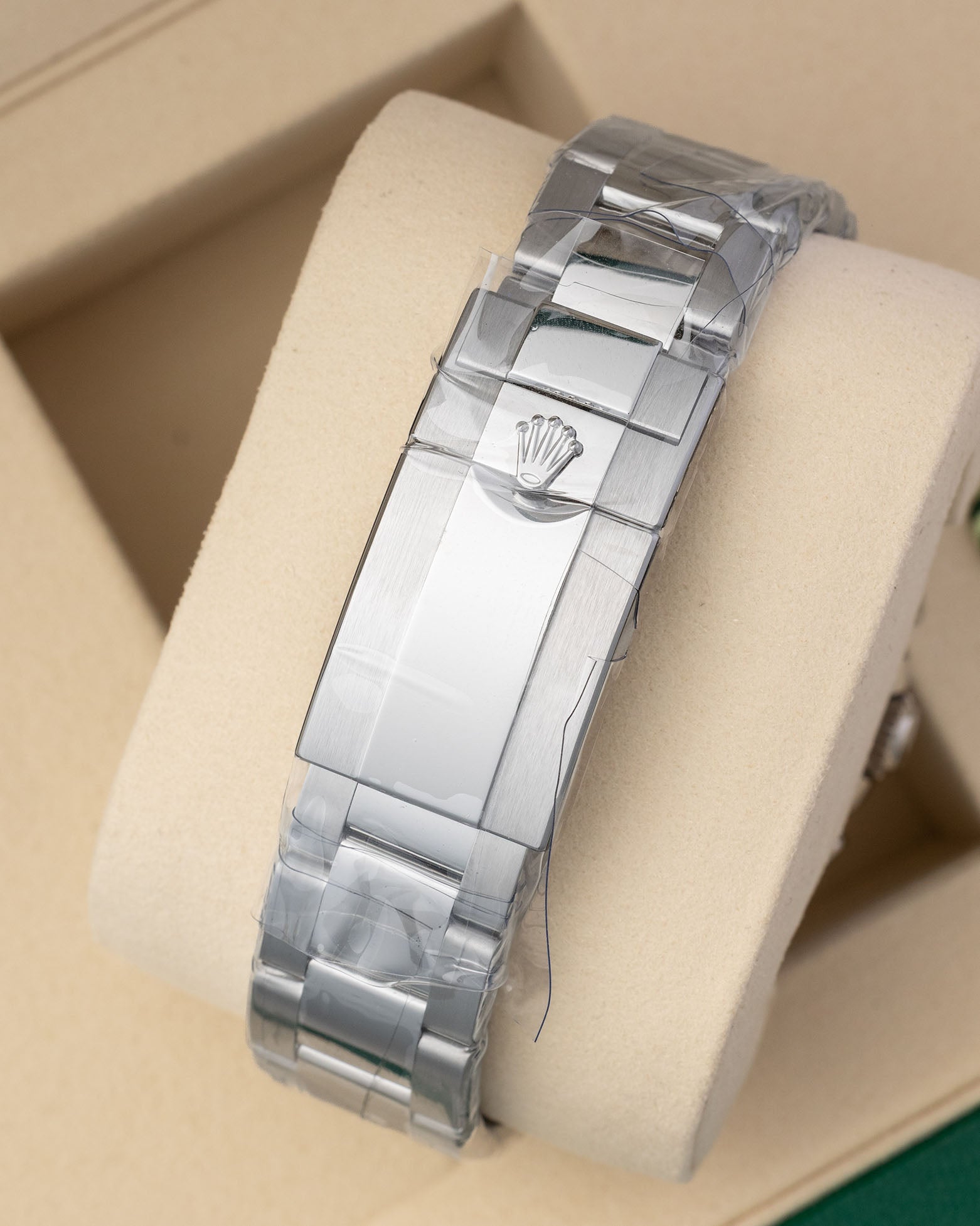 Unworn Rolex Oysterlock safety clasp on an Oyster bracelet with clear factory protective stickers for reference 126680.
