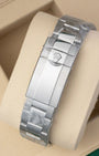 Unworn Rolex Oysterlock safety clasp on an Oyster bracelet with clear factory protective stickers for reference 126680.