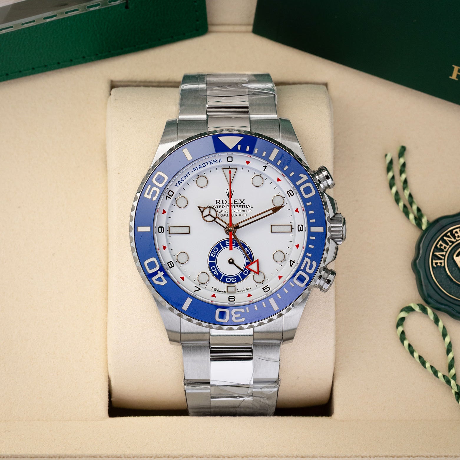 2026 unworn Rolex Yacht-Master II reference 126680 in stainless steel, featuring a white regatta chronograph dial and blue Cerachrom bezel, inside presentation box with protective factory stickers.