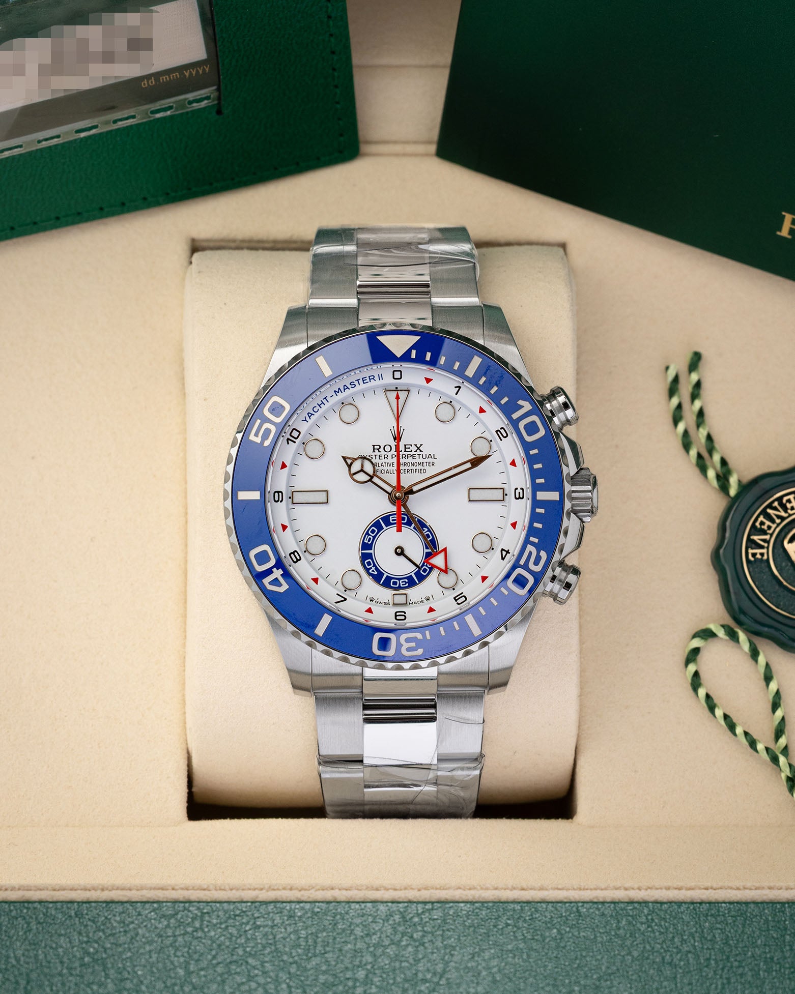 2026 unworn Rolex Yacht-Master II reference 126680 in stainless steel, featuring a white regatta chronograph dial and blue Cerachrom bezel, inside presentation box with protective factory stickers.