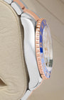 Left side profile showcasing the polished Oystersteel case edges and distinct blue Cerachrom bezel insert profile of the 44mm Rolex Yacht-Master II