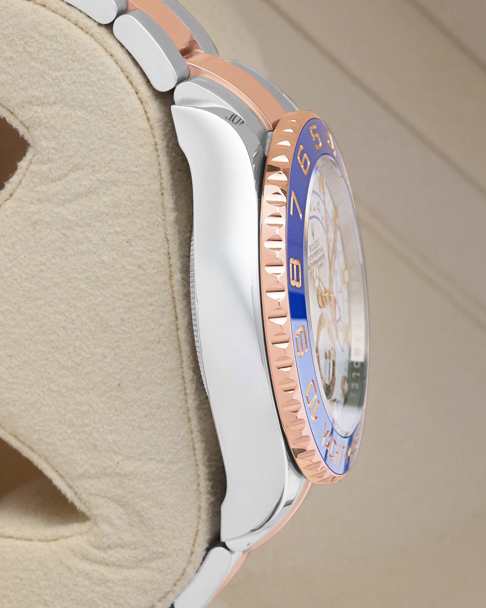 Left side profile showcasing the polished Oystersteel case edges and distinct blue Cerachrom bezel insert profile of the 44mm Rolex Yacht-Master II