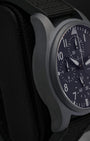Left side perspective highlighting the lightweight, scratch-resistant matte black Ceratanium alloy lugs and ergonomic case profile