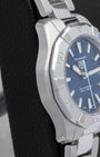 Left side profile showcasing the polished and brushed stainless steel case finish on a TAG Heuer Aquaracer Professional 200