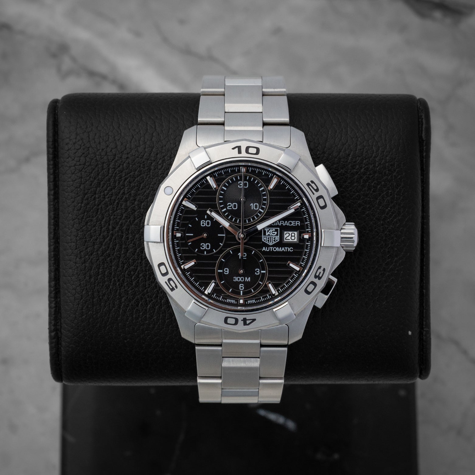 TAG Heuer Aquaracer 300M automatic chronograph 42mm watch with a black dial, model CAP2110, on display at Noah's Fine Watches & Jewelry in Dallas