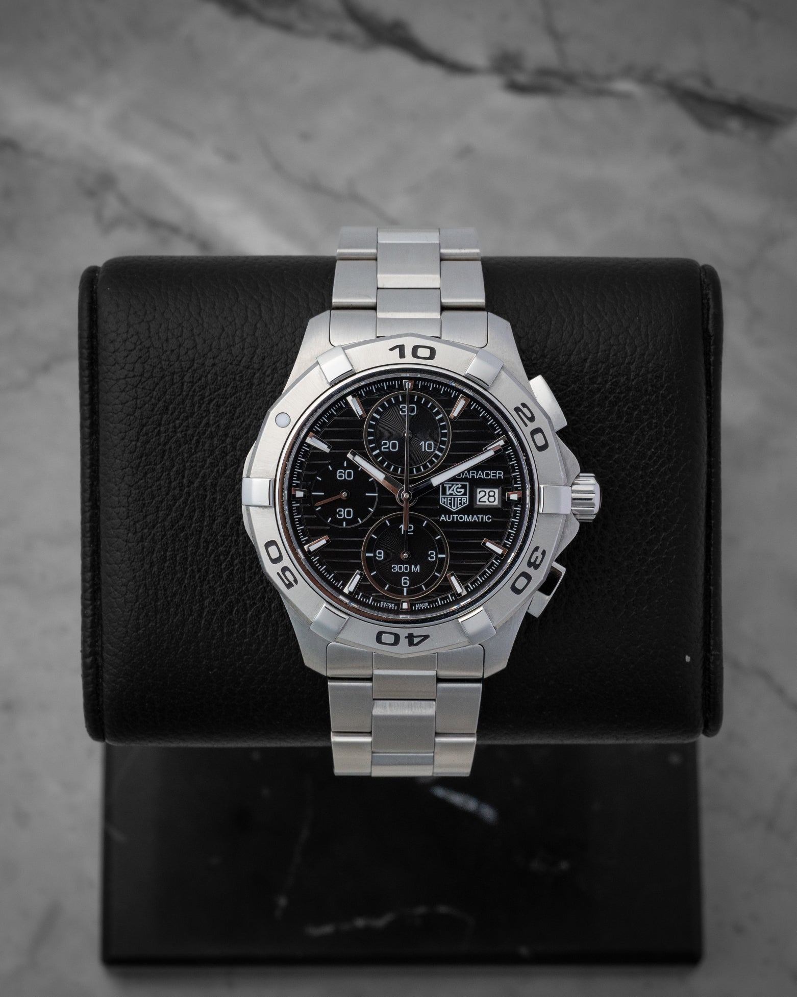 TAG Heuer Aquaracer 300M automatic chronograph 42mm watch with a black dial, model CAP2110, on display at Noah's Fine Watches & Jewelry in Dallas