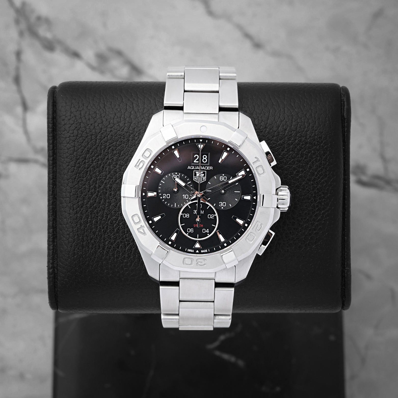 TAG Heuer Aquaracer 300M quartz chronograph 43mm watch with a black dial and grand date window, model CAY1110, on display at Noah's Fine Watches & Jewelry in Dallas