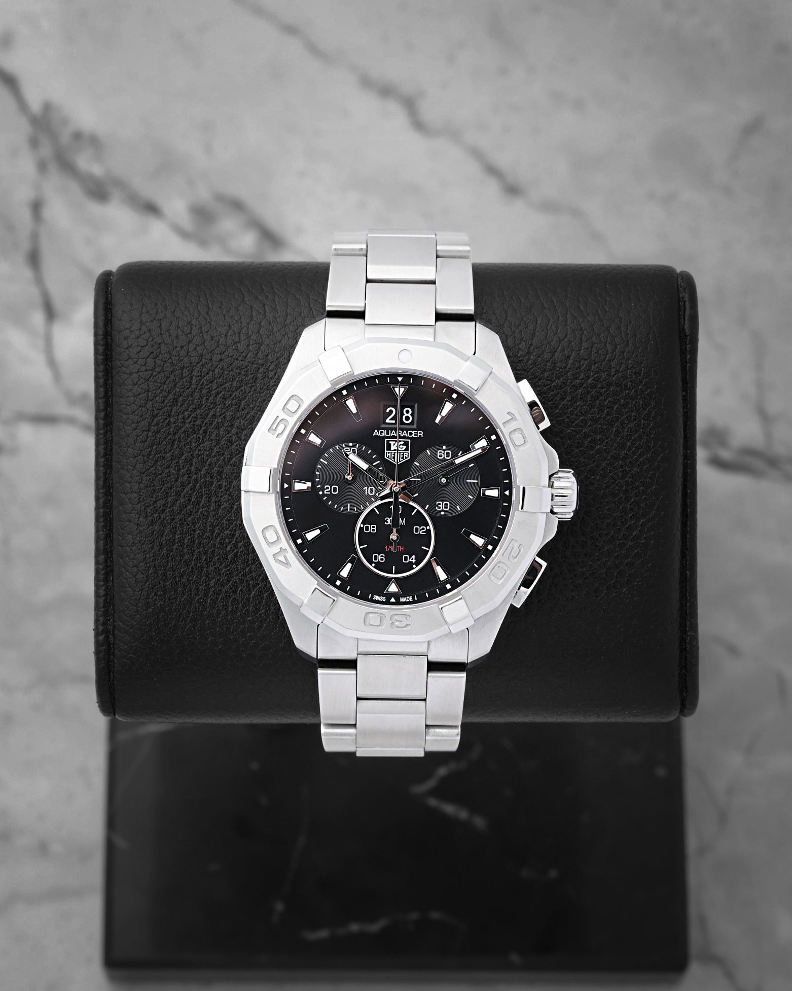 TAG Heuer Aquaracer 300M quartz chronograph 43mm watch with a black dial and grand date window, model CAY1110, on display at Noah's Fine Watches & Jewelry in Dallas
