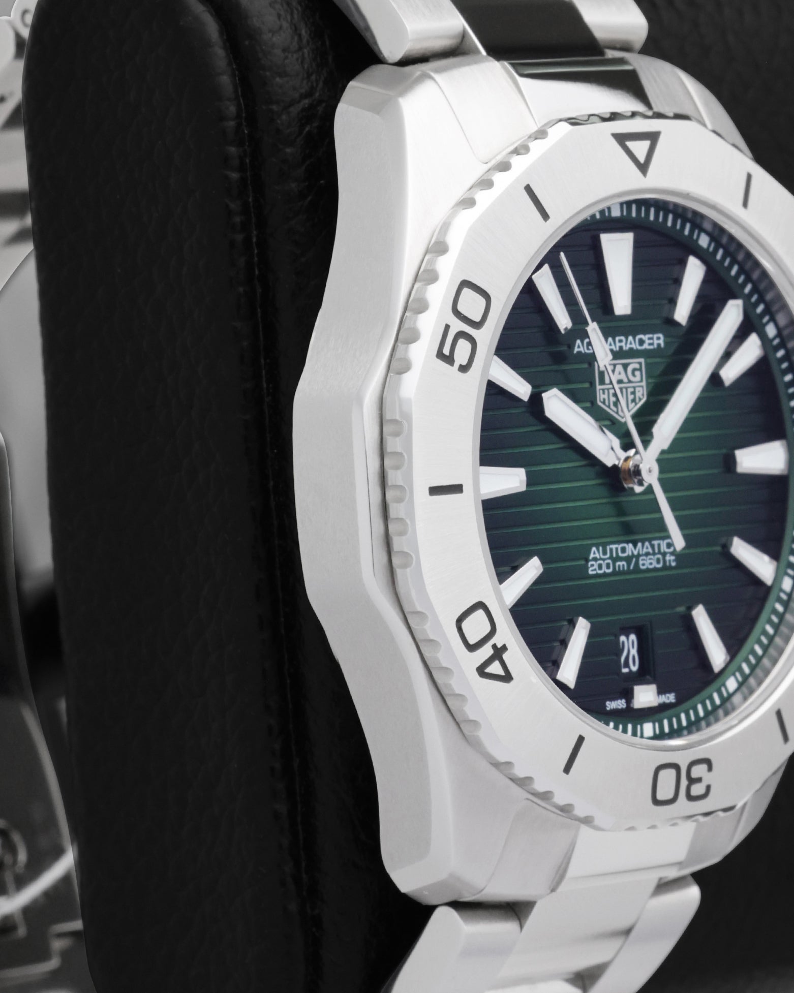 Side profile view of the polished and brushed stainless steel case on the non-crown side of a TAG Heuer Aquaracer Professional 200