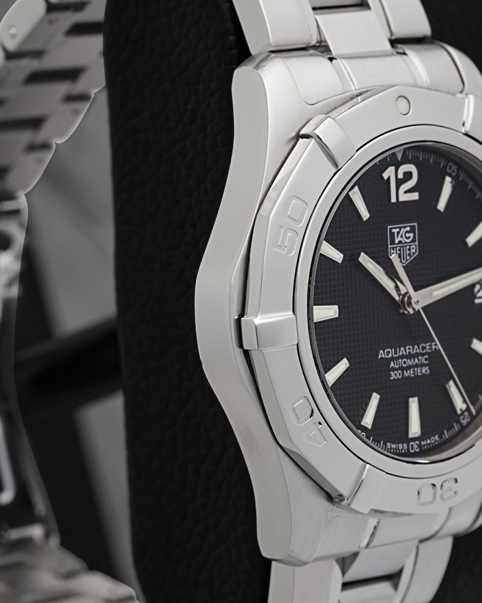 Left-side studio profile view showcasing the clean satin-brushed case wall finish and the sharp geometric taper of the lugs down to the integrated bracelet